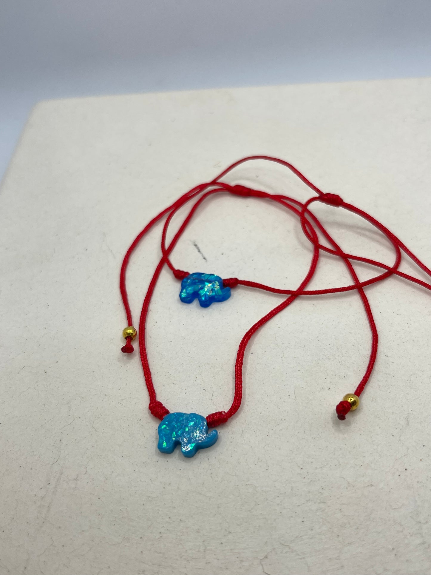 Opal elephant acrylic red string
