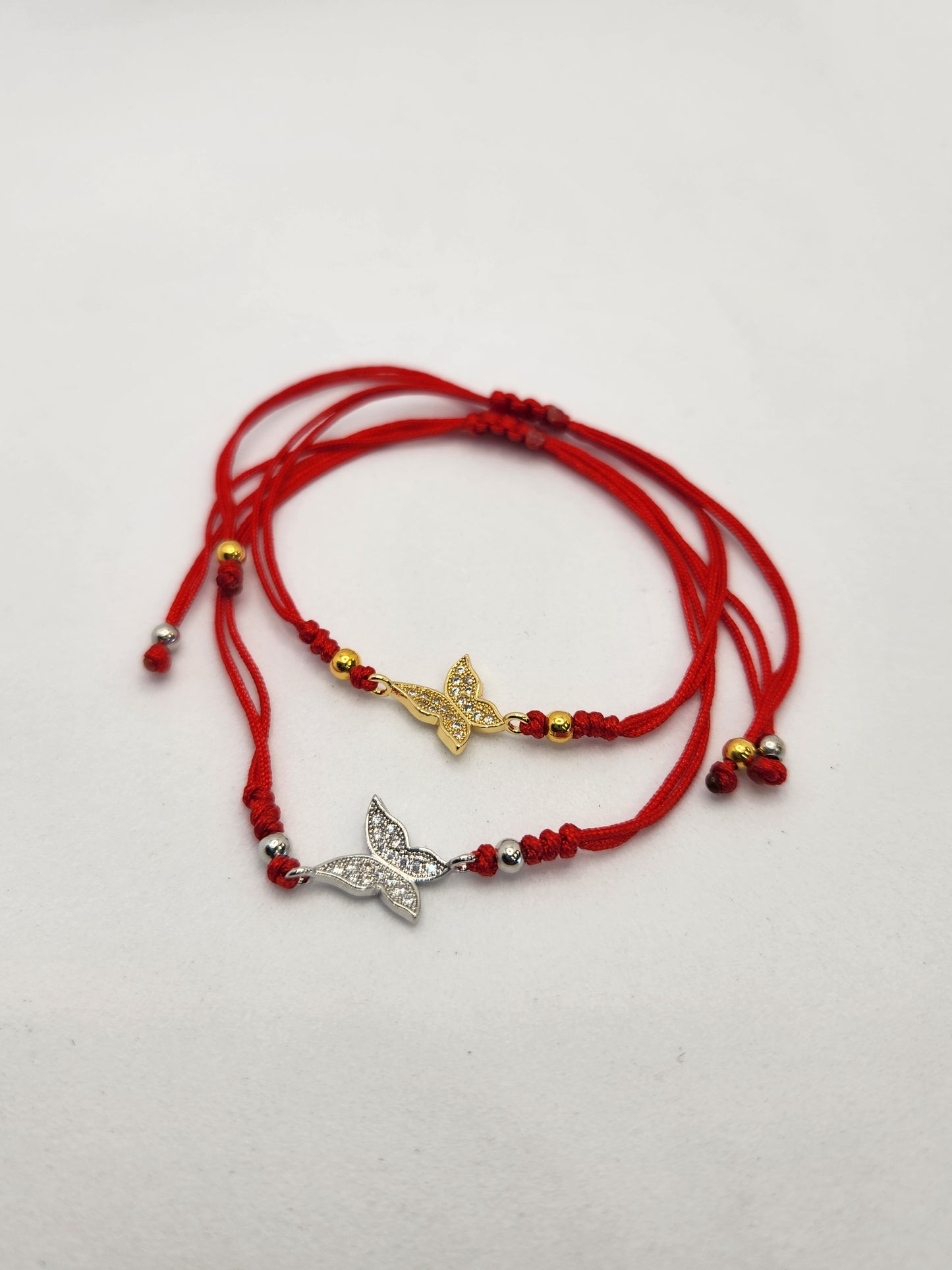 Butterfly stone charm red string