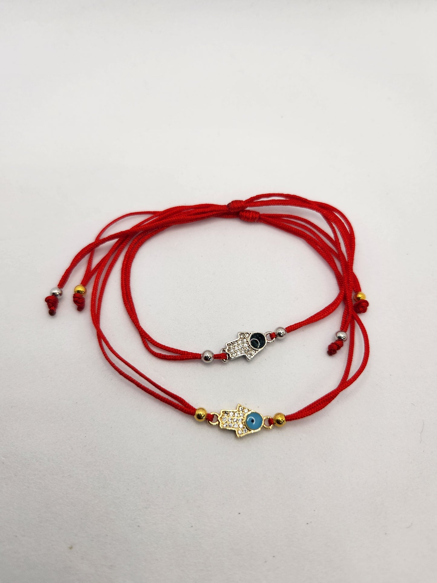 Small hamsa stone charm red string