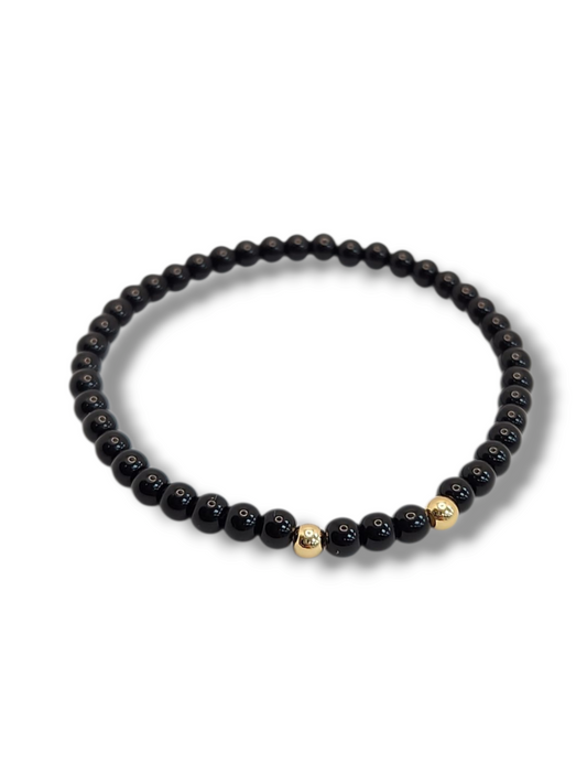 Beads 2mm stretch with gold bead- onix